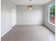 Dining room features neutral tones, tile floors, a modern light fixture, and natural light at 105 Odyssey Turn, Conyers, GA 30012