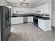 The kitchen includes stainless steel appliances and ample cabinet space at 105 Odyssey Turn, Conyers, GA 30012
