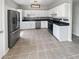 The kitchen features stainless steel appliances, countertops, and white cabinetry at 105 Odyssey Turn, Conyers, GA 30012
