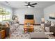 This living room features neutral decor and plenty of natural light at 105 Odyssey Turn, Conyers, GA 30012