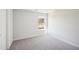 A bright bedroom with neutral walls, plush carpet and ample natural light at 11854 Rizvan Pl, Covington, GA 30014