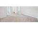 Spacious bedroom with plush carpeting and an ensuite bathroom at 11854 Rizvan Pl, Covington, GA 30014
