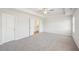 A spacious bedroom with gray carpeting at 11854 Rizvan Pl, Covington, GA 30014