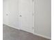 Bedroom with neutral walls, carpet flooring and closet doors at 11854 Rizvan Pl, Covington, GA 30014
