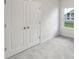 Bedroom with neutral walls, carpet flooring and a window at 11854 Rizvan Pl, Covington, GA 30014