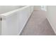 Carpeted hallway with white walls at 11854 Rizvan Pl, Covington, GA 30014