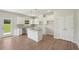 Open kitchen featuring white cabinets, granite countertops, and stainless steel appliances at 11854 Rizvan Pl, Covington, GA 30014