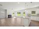 Open living space with fireplace, neutral walls and modern lighting at 11854 Rizvan Pl, Covington, GA 30014