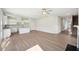 Inviting living room features an open layout, modern kitchen, and beautiful flooring at 11854 Rizvan Pl, Covington, GA 30014