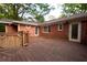 Home's backyard deck featuring wood planking, access to backyard and exterior access to home at 1398 Christmas Ne Ln, Atlanta, GA 30329