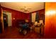 Bedroom with hardwood floors, wood paneling, ceiling fan and an open door, storage is needed at 1398 Christmas Ne Ln, Atlanta, GA 30329