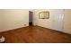 Spacious bedroom features light walls, hardwood floors, closet, and door to connecting room at 1398 Christmas Ne Ln, Atlanta, GA 30329