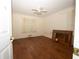 Bedroom with hardwood floors, a ceiling fan, and natural light from a single window at 1398 Christmas Ne Ln, Atlanta, GA 30329