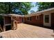 Expansive wooden deck perfect for outdoor entertaining with brick accents at 1398 Christmas Ne Ln, Atlanta, GA 30329