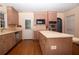 Kitchen featuring wood cabinets, laminate counters, stainless appliances, and a center island at 1398 Christmas Ne Ln, Atlanta, GA 30329