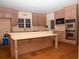 Bright kitchen features wood cabinets, laminate countertops, stainless steel appliances and a center island at 1398 Christmas Ne Ln, Atlanta, GA 30329
