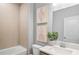Bathroom featuring tub, toilet, vanity with sink, and mirror at 244 Nesta Grove, Locust Grove, GA 30248