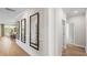 Bright hallway with decorative mirrors and hardwood flooring at 244 Nesta Grove, Locust Grove, GA 30248
