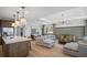 Open concept living space featuring recessed lighting, a modern chandelier, and views from kitchen island at 244 Nesta Grove, Locust Grove, GA 30248