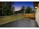 A cozy deck with wood railing and a fresh view of the fenced backyard at 3355 Wesley Chapel Rd, Decatur, GA 30034