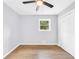 Bright bedroom features hardwood floor, window and closet at 3355 Wesley Chapel Rd, Decatur, GA 30034