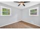 Empty bedroom with vinyl flooring, a ceiling fan, and a window at 3355 Wesley Chapel Rd, Decatur, GA 30034
