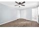 Bedroom featuring hardwood floors, closet, ceiling fan, and attached bathroom at 3355 Wesley Chapel Rd, Decatur, GA 30034