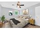 Cozy bedroom featuring neutral tones, stylish decor, and a ceiling fan at 3355 Wesley Chapel Rd, Decatur, GA 30034