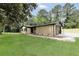 Home with a newly-paved driveway that leads to an attached garage at 3355 Wesley Chapel Rd, Decatur, GA 30034