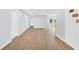 Hallway has fresh paint and new wood floors, doors lead to other rooms at 3355 Wesley Chapel Rd, Decatur, GA 30034