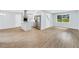 Open-concept living space with a kitchen island, stainless steel appliances, and plenty of natural light at 3355 Wesley Chapel Rd, Decatur, GA 30034