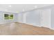 Spacious room with new wood floors, fresh paint, and natural light at 3355 Wesley Chapel Rd, Decatur, GA 30034