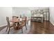 Dining area with wood table, kitchen with gray cabinets and stainless steel appliances at 4044 Andover Cir, Mcdonough, GA 30252