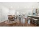 Bright dining area with wood floors, a round wood table and views into the kitchen at 4044 Andover Cir, Mcdonough, GA 30252