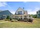 Charming two-story home with a welcoming front porch and beautifully landscaped front yard at 4044 Andover Cir, Mcdonough, GA 30252