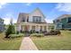 Charming two-story home with a welcoming front porch and beautifully landscaped front yard at 4044 Andover Cir, Mcdonough, GA 30252