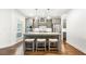 Bright kitchen with gray cabinets, stainless steel appliances, and a granite island at 4044 Andover Cir, Mcdonough, GA 30252