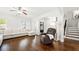 Bright and spacious living room with hardwood floors and elegant wainscoting at 4044 Andover Cir, Mcdonough, GA 30252