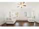 Bright and spacious living room featuring a large sectional sofa and hardwood floors at 4044 Andover Cir, Mcdonough, GA 30252
