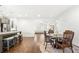 Open-concept living space with wood floors, a dining area, and views to a living room at 4044 Andover Cir, Mcdonough, GA 30252