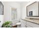 Stylish powder room featuring granite countertops and modern fixtures at 4044 Andover Cir, Mcdonough, GA 30252