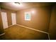 Neutral colored bedroom featuring a double door closet and a window at 4190 Heather Way, Cumming, GA 30041