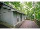 The deck is perfect for enjoying views of the wooded surroundings at 4190 Heather Way, Cumming, GA 30041