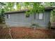 Home exterior with mature landscaping, including a wooded area, and siding at 4190 Heather Way, Cumming, GA 30041
