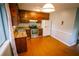 Kitchen with stainless-steel oven, refrigerator, and sink at 4190 Heather Way, Cumming, GA 30041