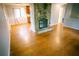 Bright living room featuring a stone fireplace, wood floors, and natural light at 4190 Heather Way, Cumming, GA 30041