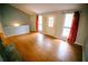 Living room with hardwood floors, large windows, and light-filled ambiance at 4190 Heather Way, Cumming, GA 30041