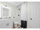 Well-lit bathroom with a modern vanity, a shower, and black and white accents at 139 Thunder Ridge Ln, Acworth, GA 30101