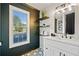 Stylish bathroom with black accent wall, floating shelves, and modern vanity with vessel sink at 139 Thunder Ridge Ln, Acworth, GA 30101