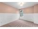 Carpeted bedroom with wainscoting, neutral walls, and plenty of natural light at 139 Thunder Ridge Ln, Acworth, GA 30101
